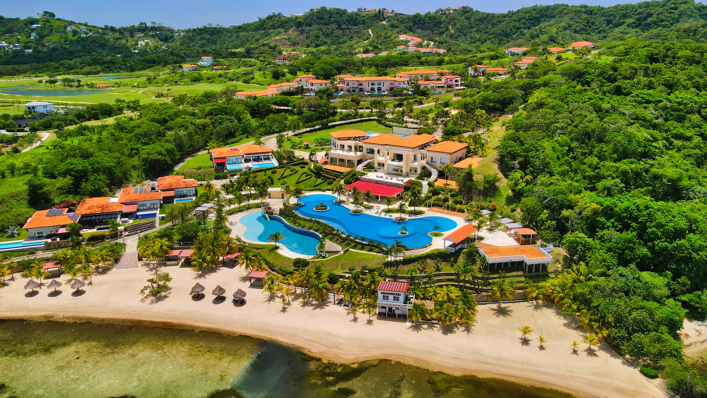 Pool and Caribbean shoreline at Pristine Bay