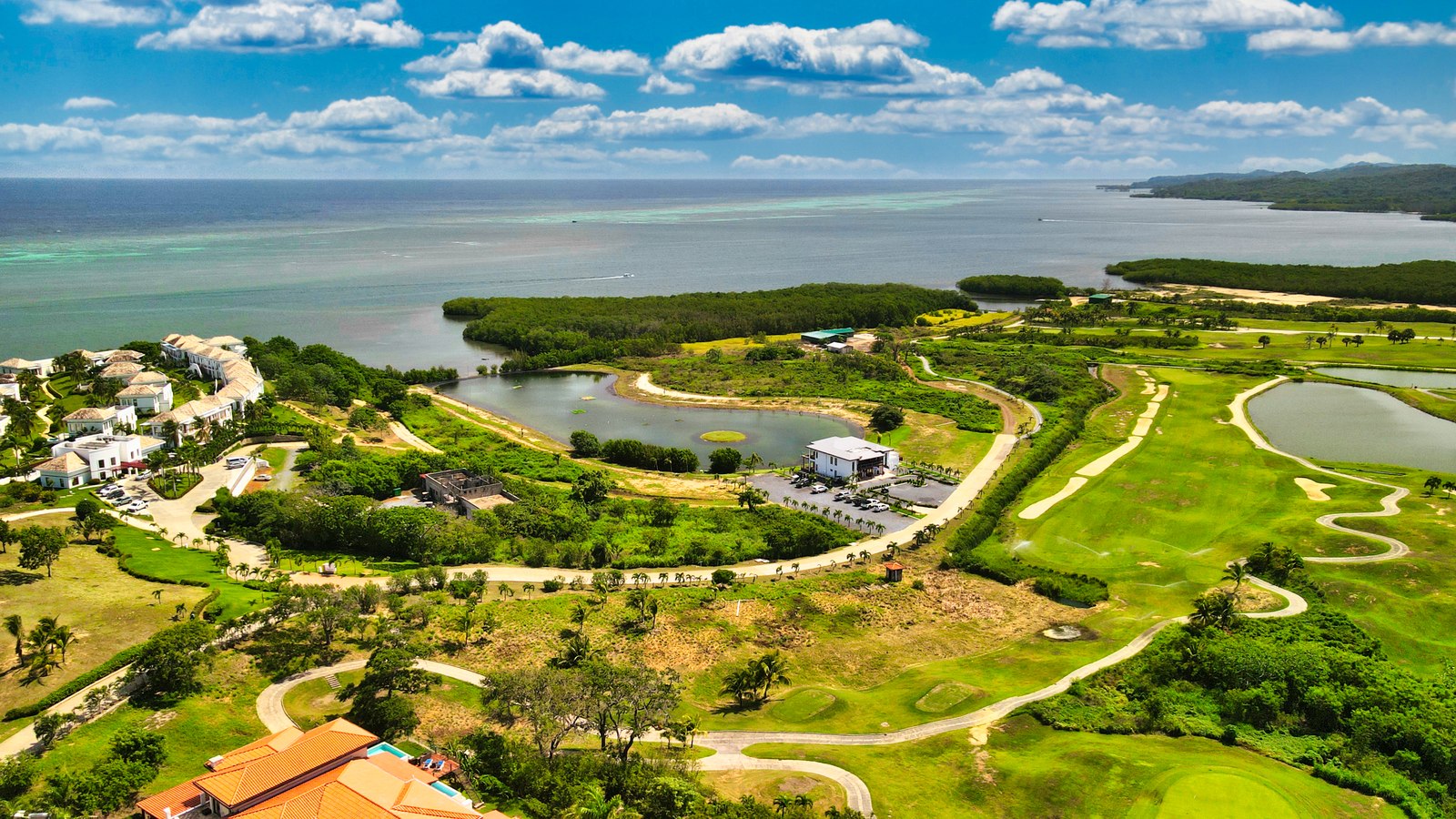 Aerial view of the Black Pearl Golf Course and Caribbean coastline at Pristine Bay